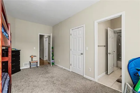 a view of room with furniture and closet