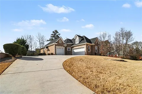 a view of a house with a snow in the background