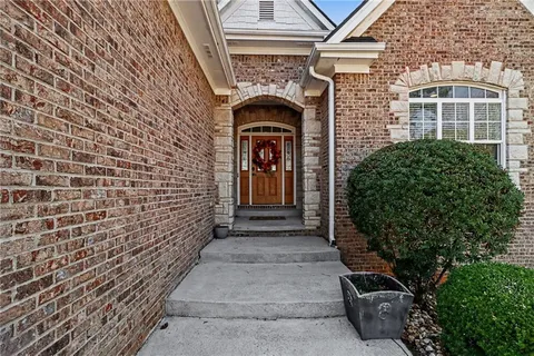 a front view of a house with glass windows