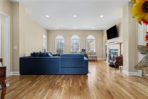 a living room with furniture and a flat screen tv