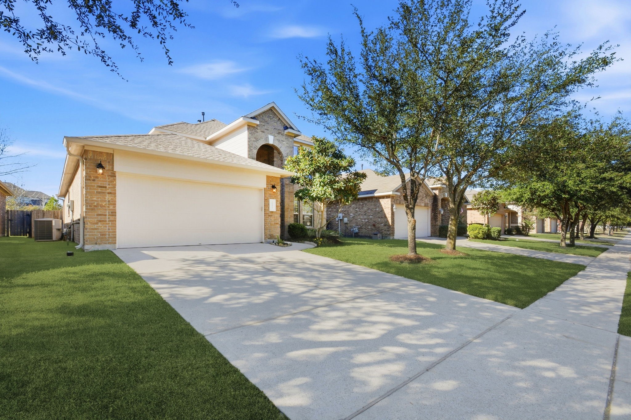 25523 Marmite Drive Tomball, TX 77375 - Photo 2 of 50 a front view of a house with a yard and garage