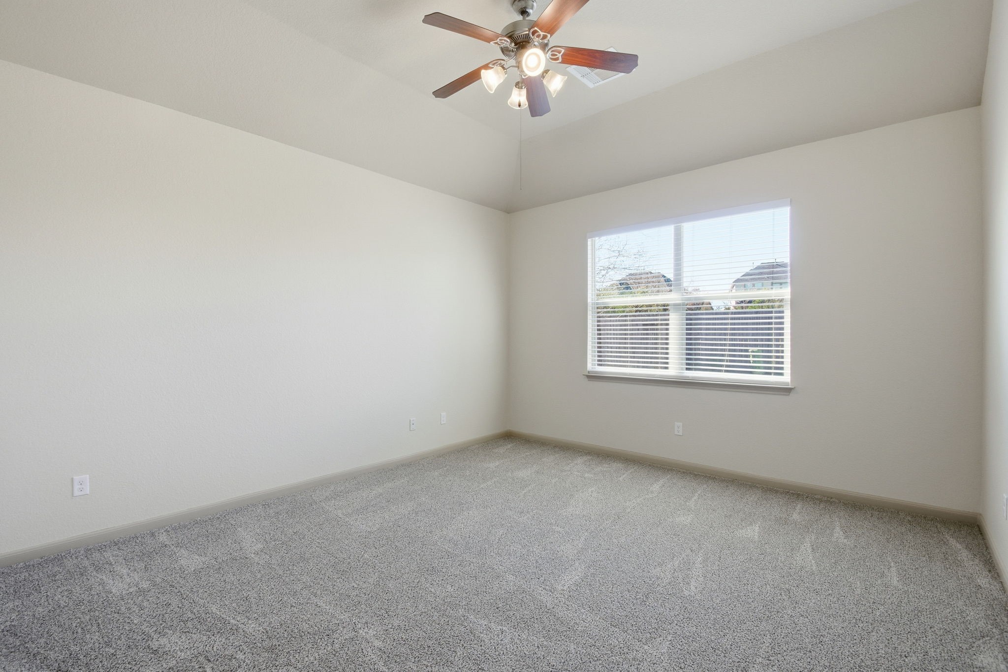 25523 Marmite Drive Tomball, TX 77375 - Photo 23 of 50 an empty room with a window and a fan