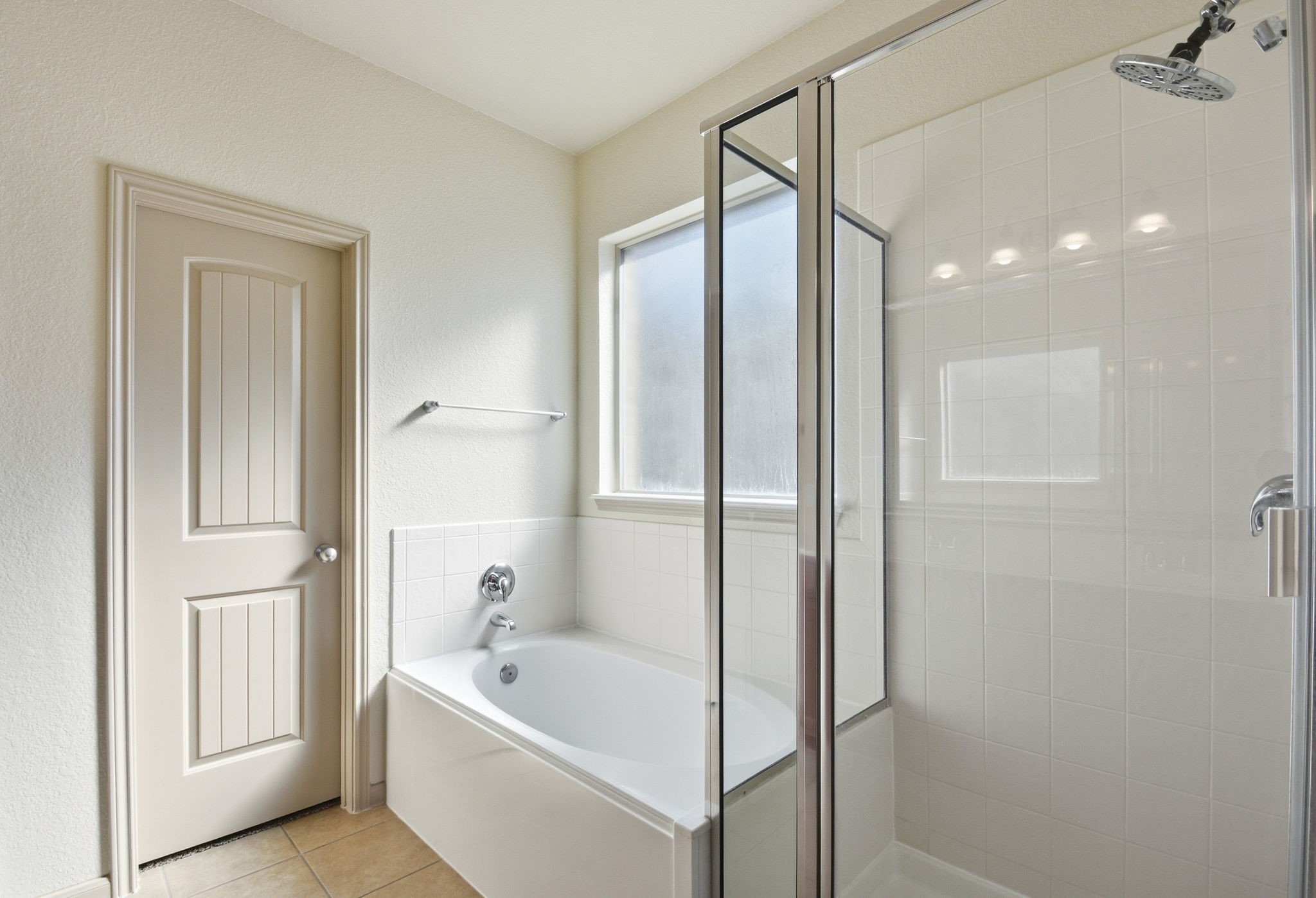 25523 Marmite Drive Tomball, TX 77375 - Photo 27 of 50 a bathroom with a tub shower and sink