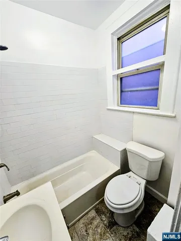a bathroom with a sink and a toilet