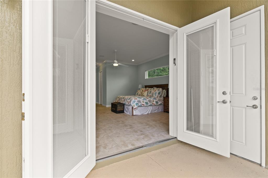 8065 Bridgeport Bay Circle Mount Dora, FL 32757 - Photo 21 of 60 a view of a room that has a bed in it