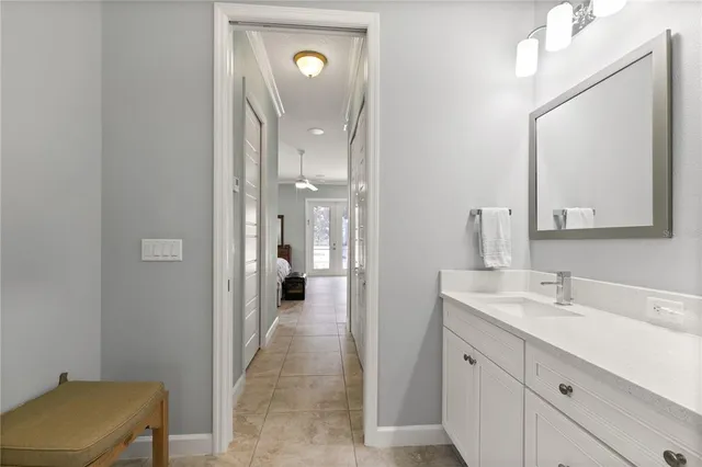 a bathroom with a sink mirror and toilet