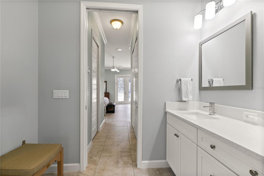 8065 Bridgeport Bay Circle Mount Dora, FL 32757 - Photo 23 of 60 a spacious bathroom with a double vanity sink mirror and