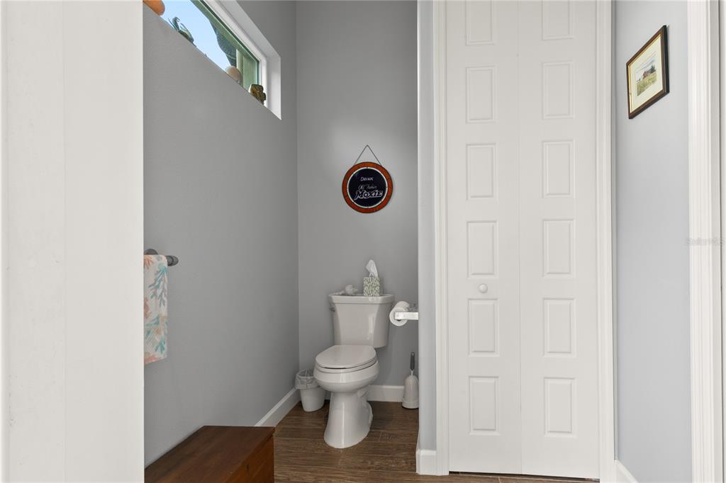 8065 Bridgeport Bay Circle Mount Dora, FL 32757 - Photo 30 of 60 a bathroom with a toilet and a shower