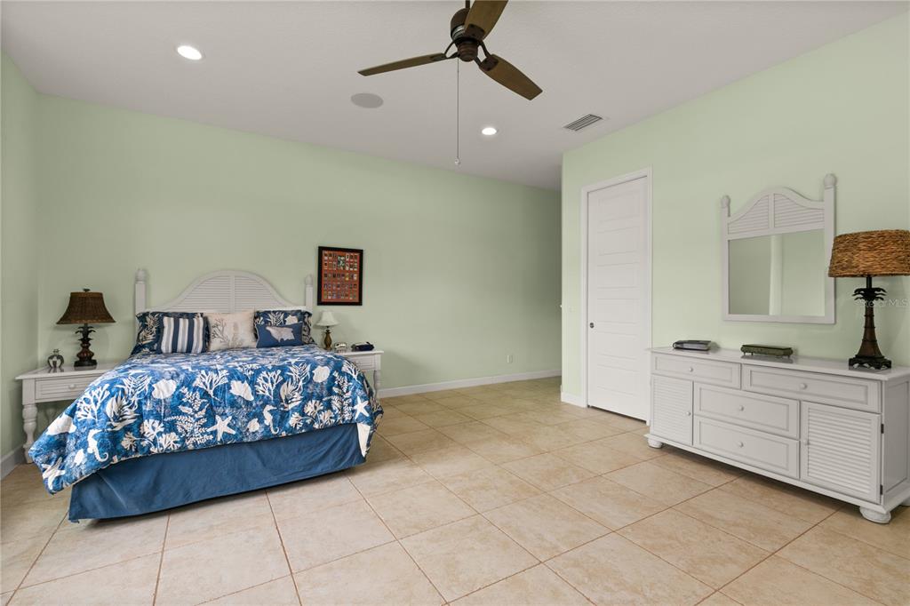 8065 Bridgeport Bay Circle Mount Dora, FL 32757 - Photo 34 of 60 a bedroom with furniture and window