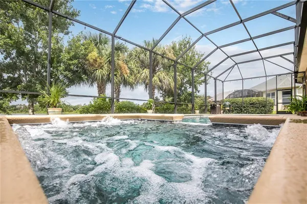 a view of swimming pool with a patio