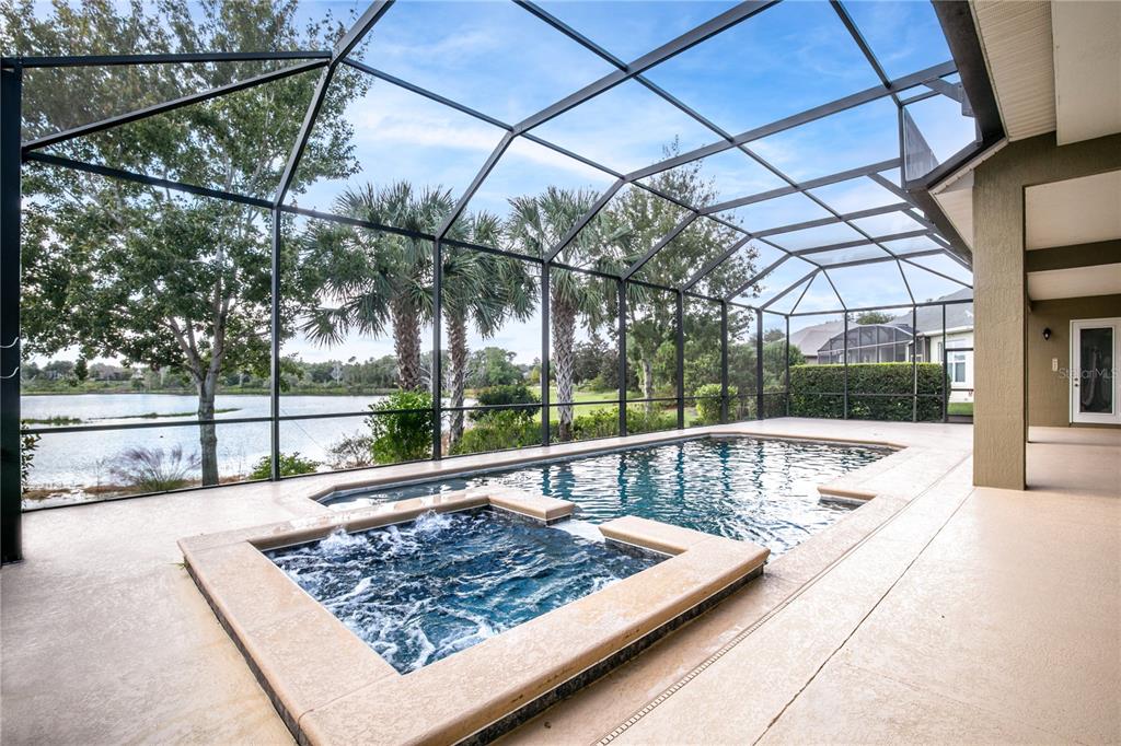 8065 Bridgeport Bay Circle Mount Dora, FL 32757 - Photo 7 of 60 a view of swimming pool with a patio