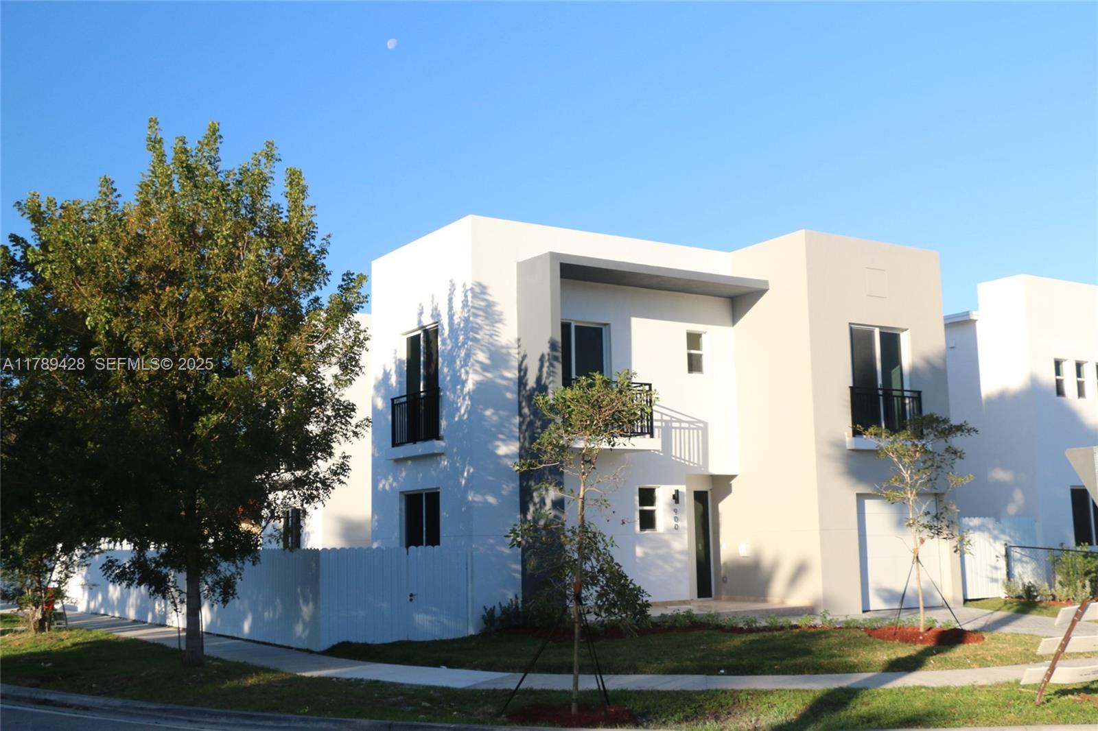 900 Southwest 24th Road Miami, FL 33129 - Photo 2 of 27 a front view of a house with a yard
