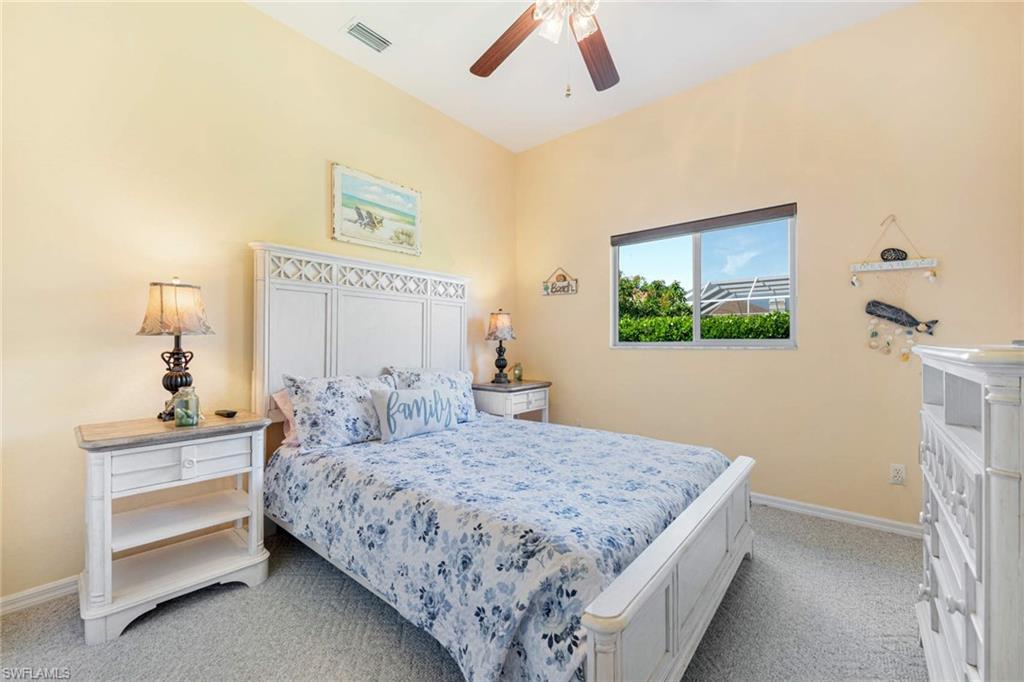 2035 Teagarden Lane Naples, FL 34110 - Photo 11 of 21 a bedroom with a bed and a dresser