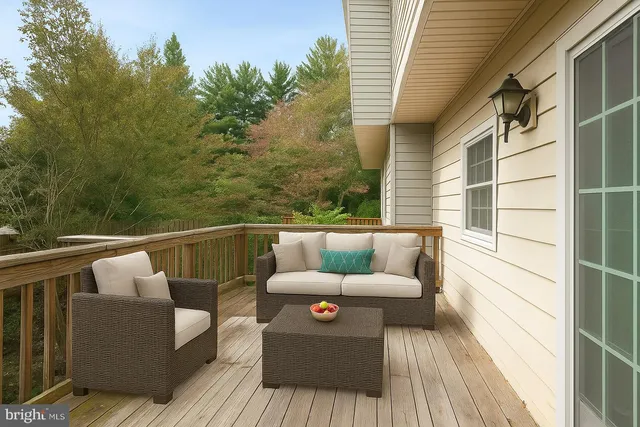 a view of an empty room with a ceiling fan