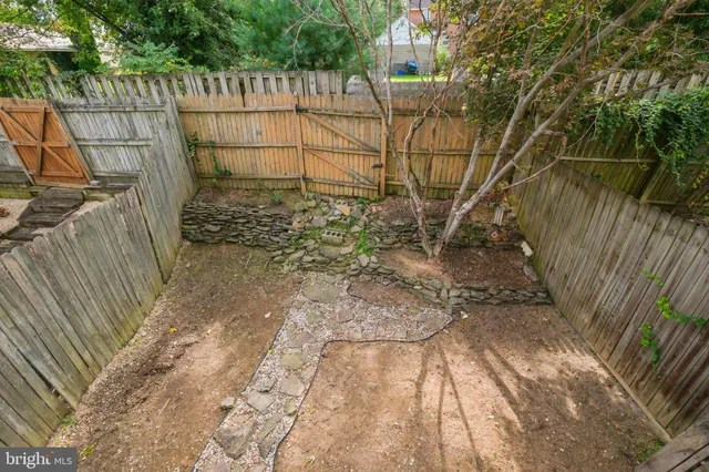 a car parked in front of a brick house