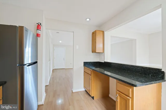 a kitchen with a stove and a refrigerator
