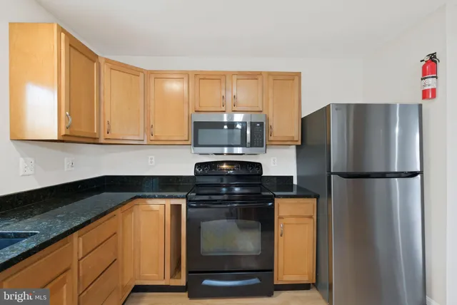 a view of balcony with wooden floor and fence