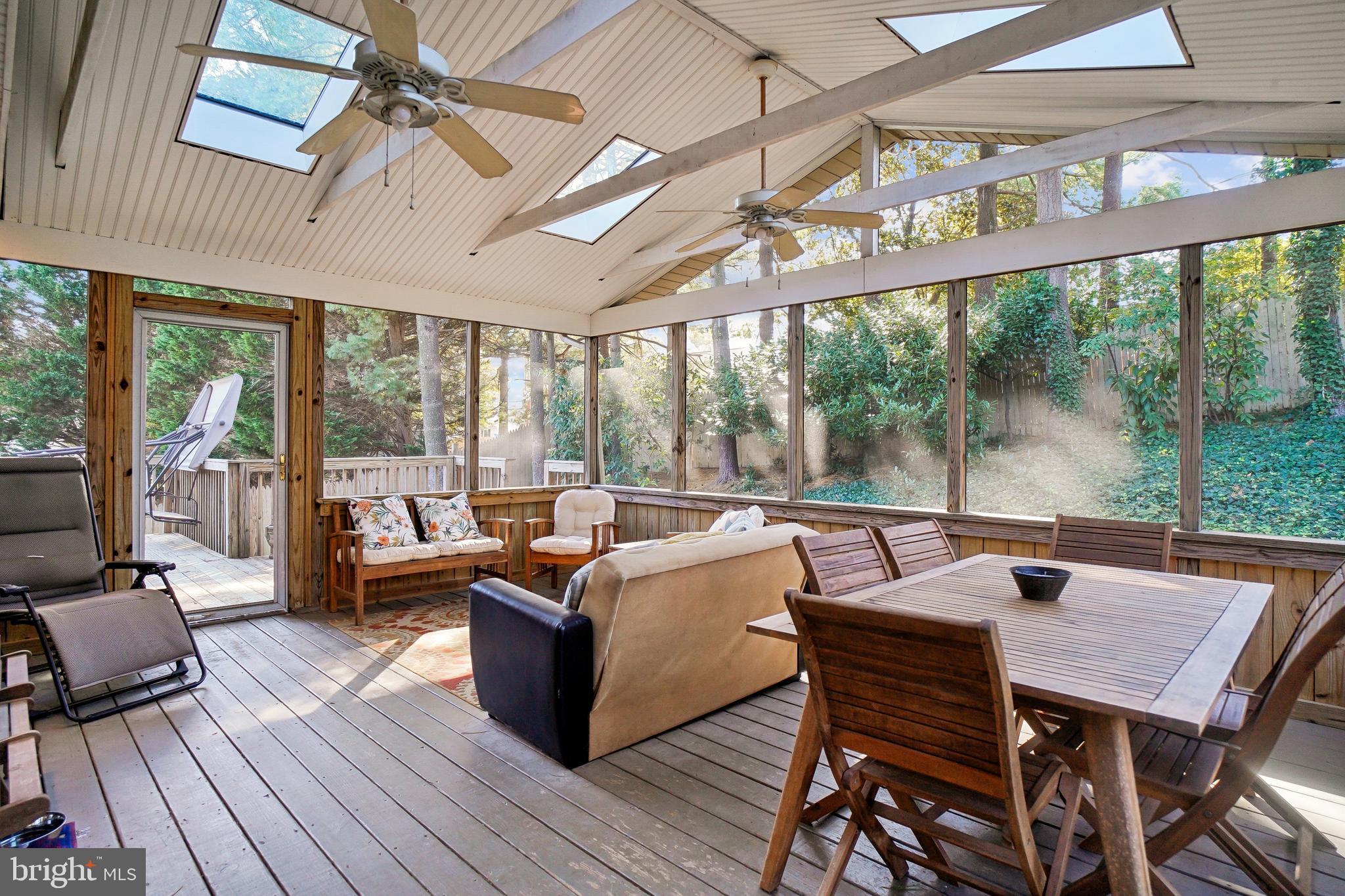 10408 Windfall Court Damascus, MD 20872 - Photo 13 of 38 a outdoor dining space with furniture and wooden floor