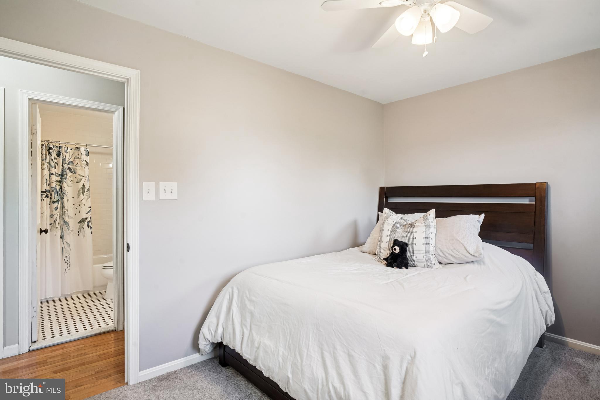 10408 Windfall Court Damascus, MD 20872 - Photo 24 of 38 a bedroom with a bed and a mirror
