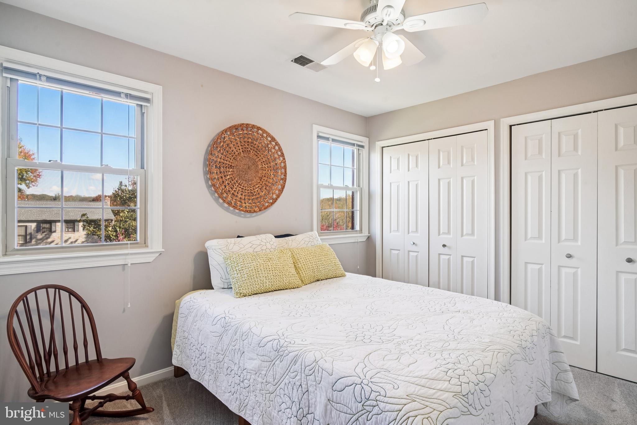 10408 Windfall Court Damascus, MD 20872 - Photo 25 of 38 a bedroom with a large bed and a chandelier