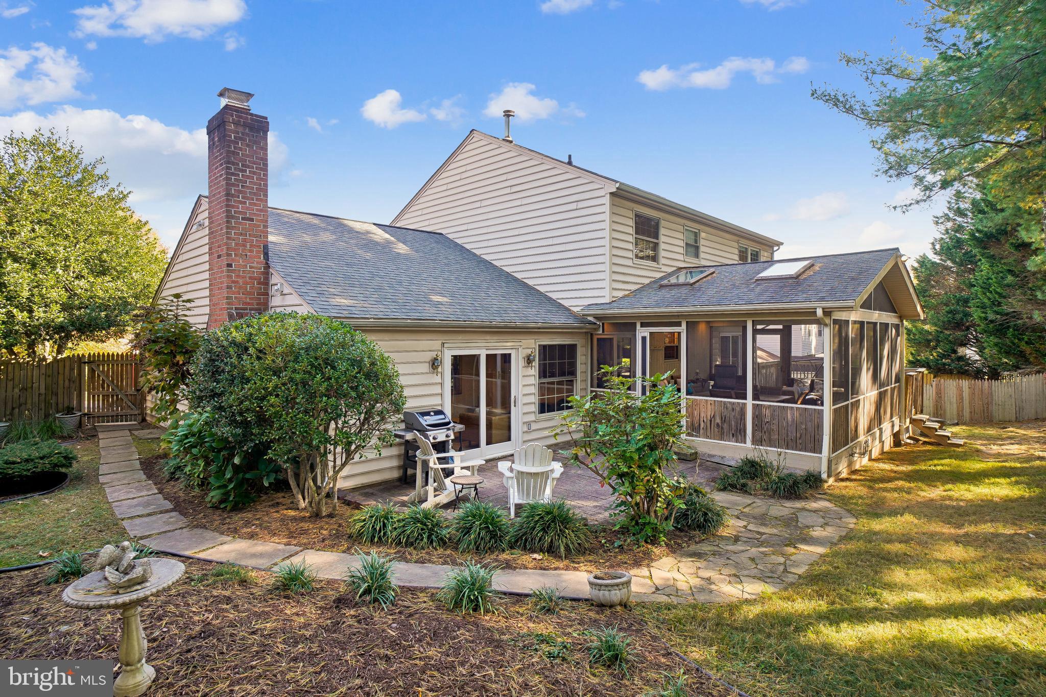 10408 Windfall Court Damascus, MD 20872 - Photo 31 of 38 a front view of a house with garden