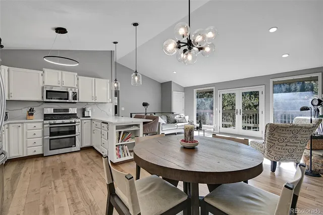 a view of a dining room with furniture window and outside view