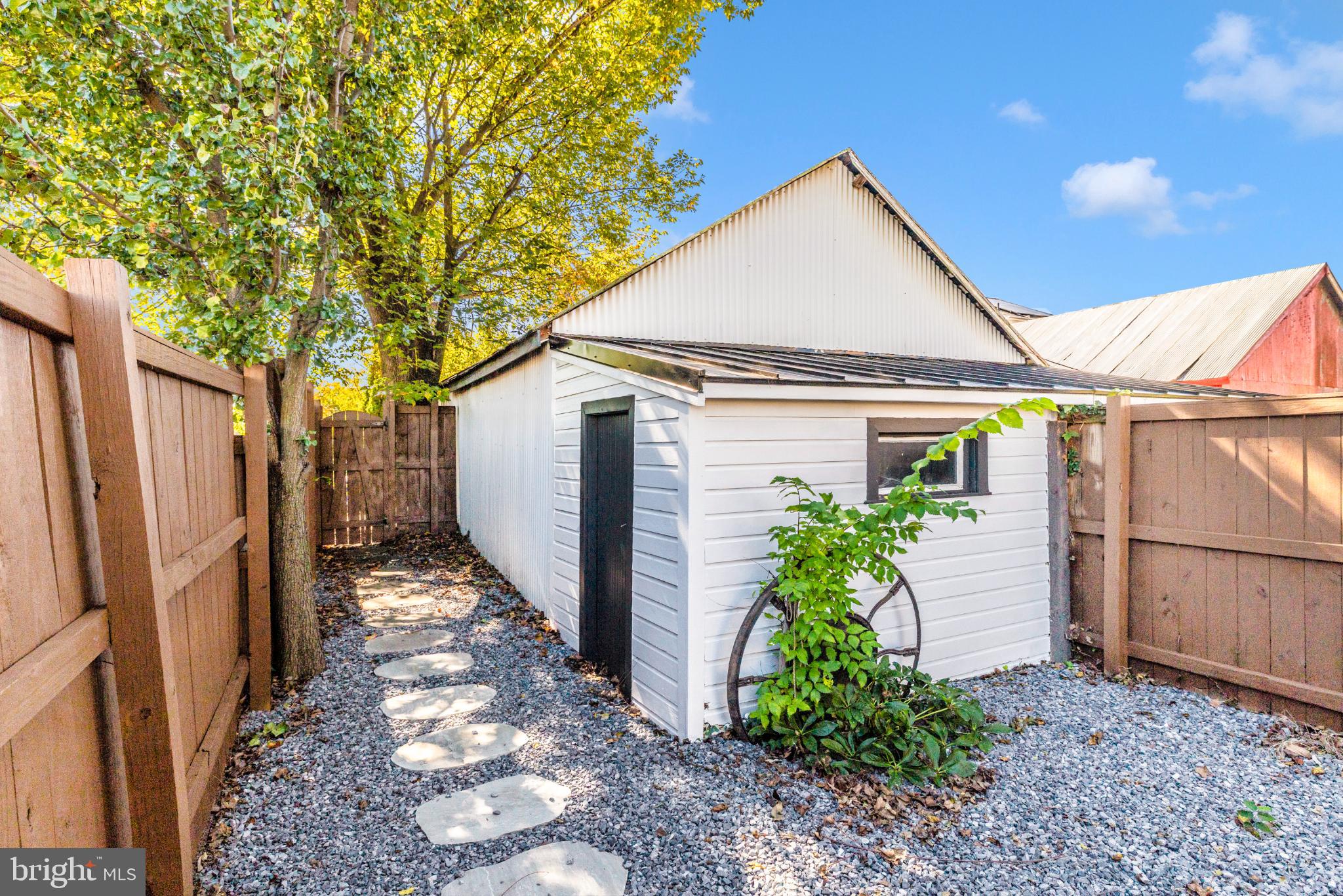 8 West 7th Street Frederick, MD 21701 - Photo 5 of 8 Charming garden shed with stone pathway.