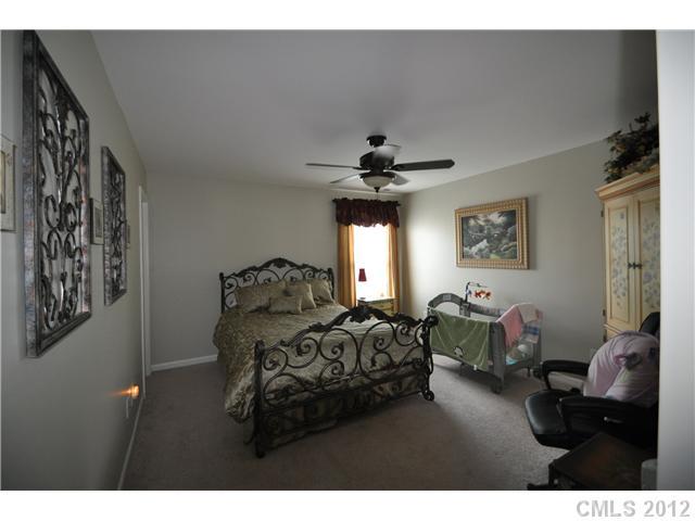 1156 Spicewood Pines Road Fort Mill, SC 29708 - Photo 8 of 16 a living room with furniture and a chandelier