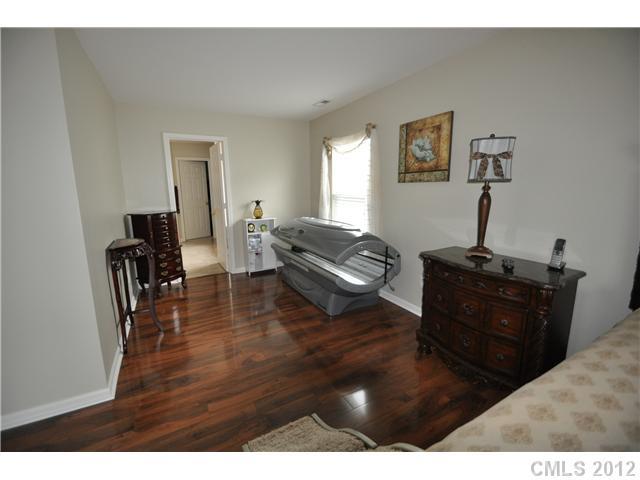 1156 Spicewood Pines Road Fort Mill, SC 29708 - Photo 10 of 16 a living room with furniture and a wooden floor
