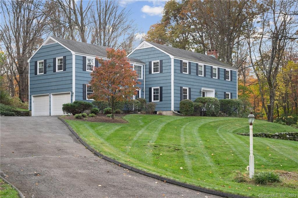 5 Hidden Lake Ridge Road Wilton, CT 06897 - Photo 1 of 1 a front view of a house with a yard