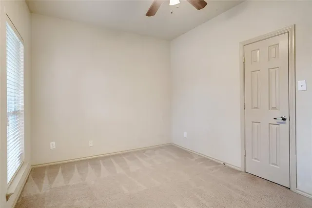 an empty room with a empty space and a window