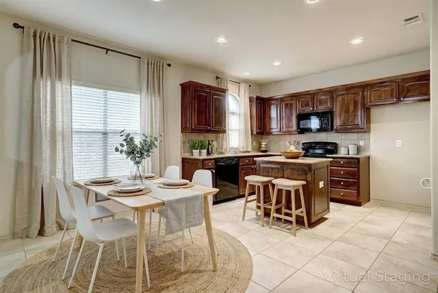 a kitchen with a table and chairs in it