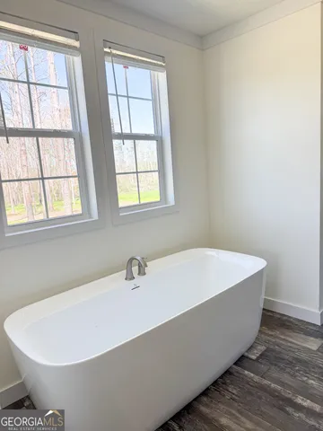 a white bath tub sitting in a bathroom