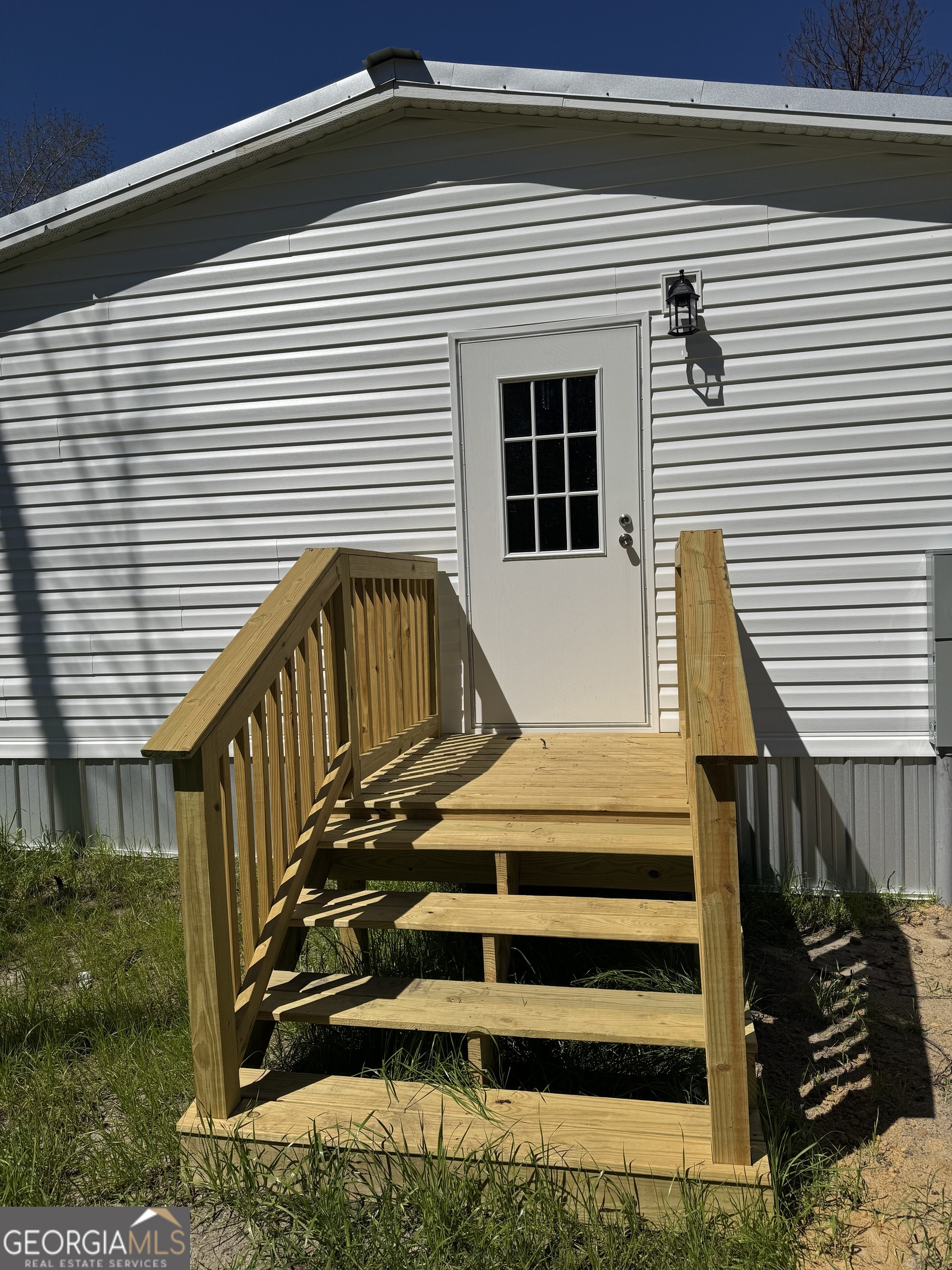 1505 West 4th St Extension Alma, GA 31510 - Photo 19 of 22 a view of wooden house with a small space