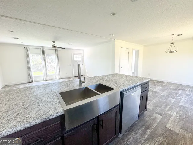 a kitchen with granite countertop a sink and a granite counter tops