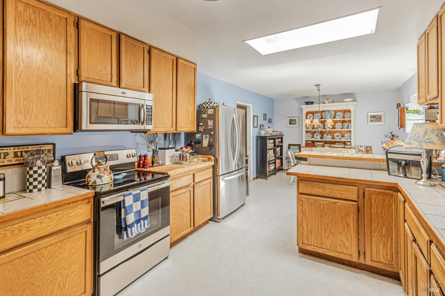 3590 Burnside Road Sebastopol, CA 95472 - Photo 15 of 69 a kitchen with stainless steel appliances granite countertop a stove and a refrigerator