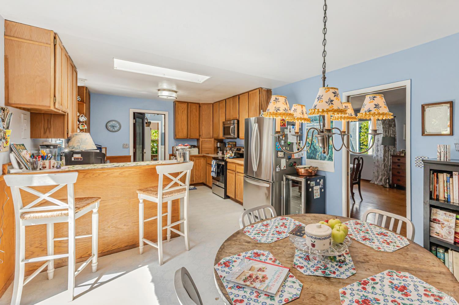 3590 Burnside Road Sebastopol, CA 95472 - Photo 17 of 69 a living room with stainless steel appliances kitchen island granite countertop a table chairs and a view of living room