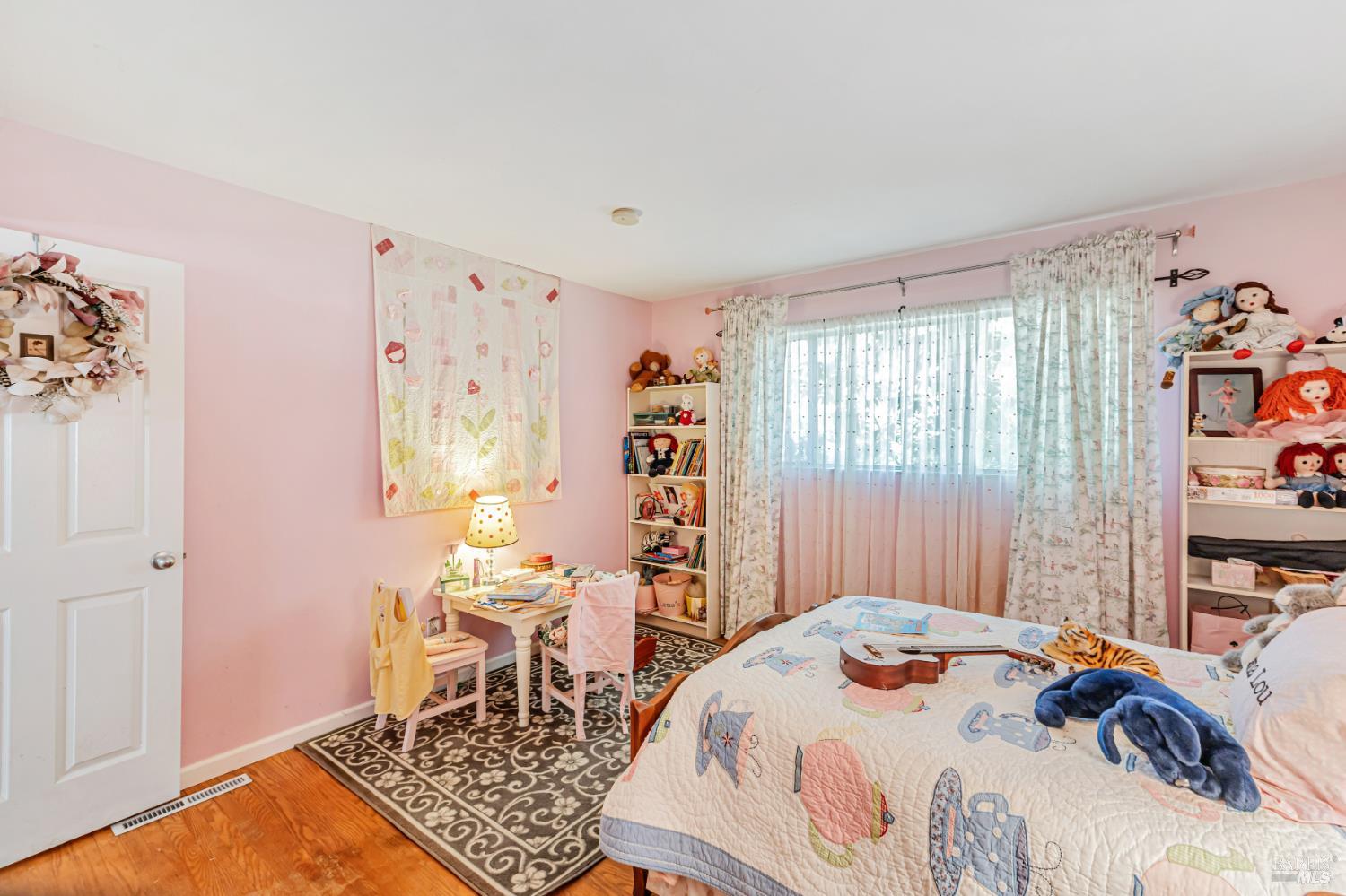 3590 Burnside Road Sebastopol, CA 95472 - Photo 25 of 69 a bedroom with a bed and a table in it