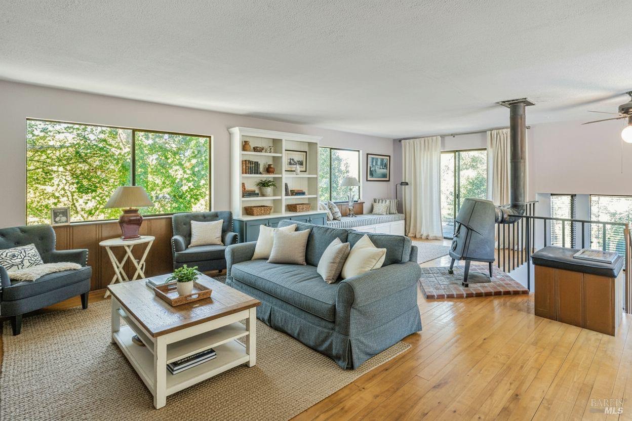 3590 Burnside Road Sebastopol, CA 95472 - Photo 37 of 69 a living room with furniture and a large window
