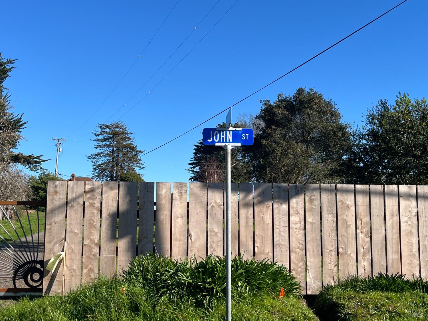 0 John Street Tomales, CA 94971 - Photo 14 of 20 a view of a house with a small yard and floor to ceiling window