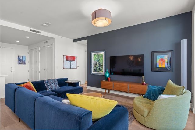 a white bath tub sitting next to a white sink
