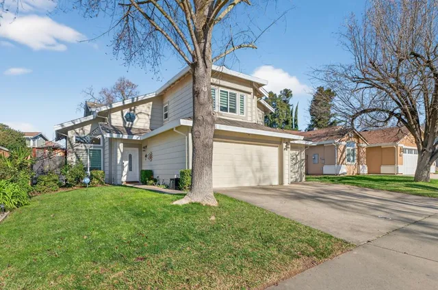 front view of a house with a big yard