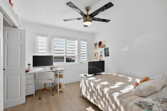 a view of a house with swimming pool and sitting area