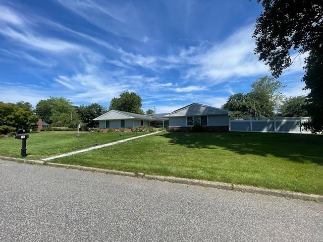 Undisclosed Address Stony Brook, NY 11790 - Photo 1 of 26 a view of a house with a big yard