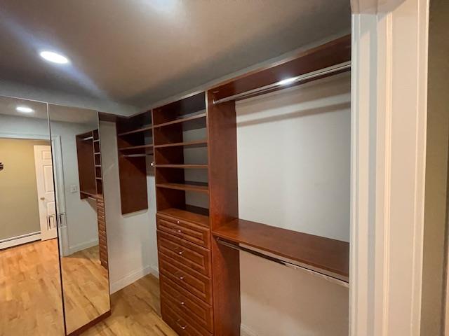 Undisclosed Address Stony Brook, NY 11790 - Photo 17 of 26 a view of walk in closet with clothes and shoes