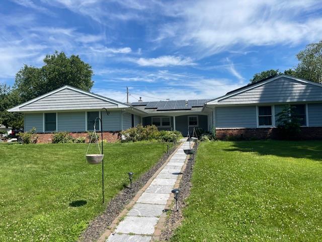 Undisclosed Address Stony Brook, NY 11790 - Photo 2 of 26 a front view of a house with garden