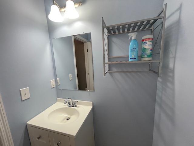Undisclosed Address Stony Brook, NY 11790 - Photo 9 of 26 a bathroom with a sink and mirror