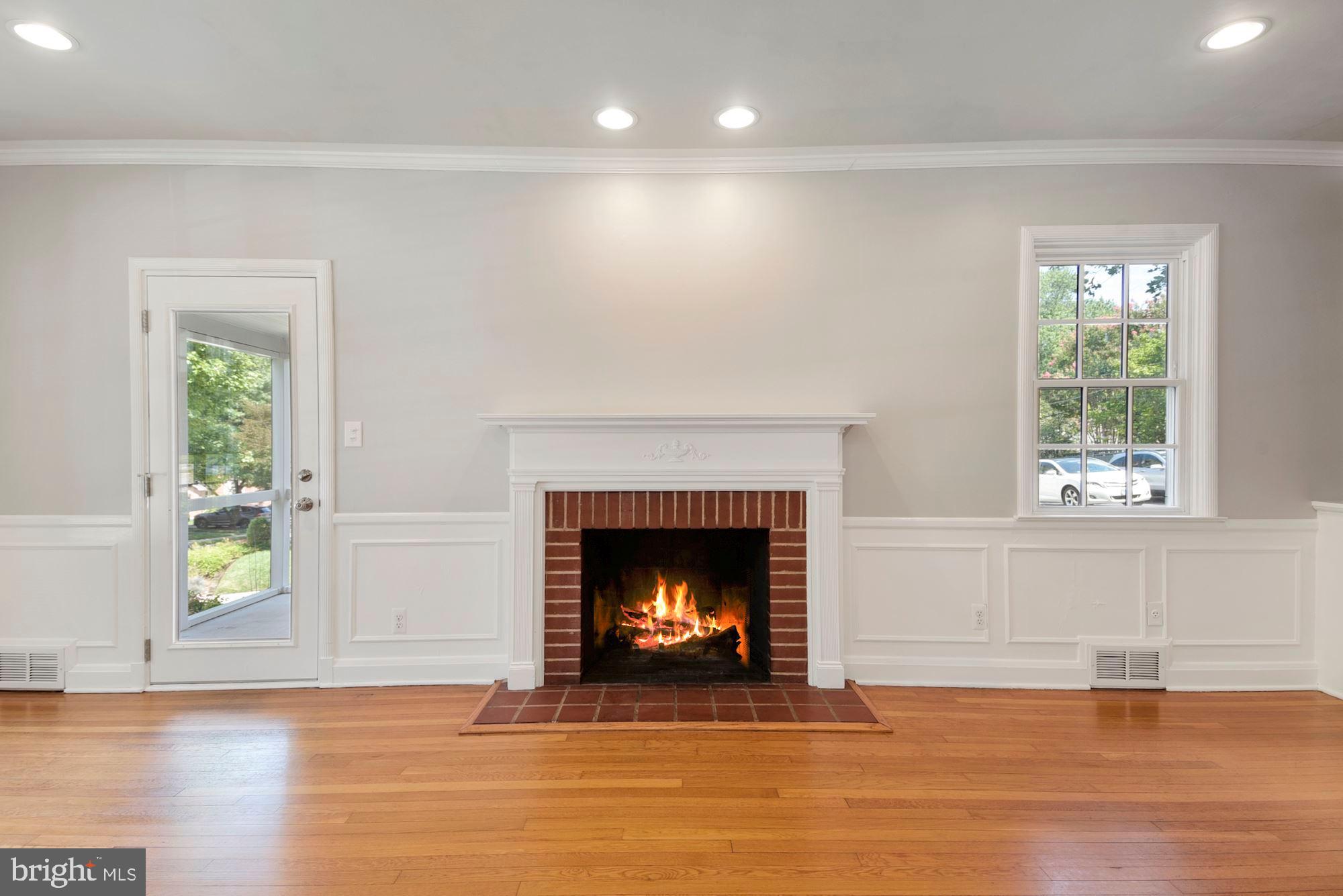 527 Yarmouth Road Towson, MD 21286 - Photo 11 of 61 Living room with fireplace and door porch