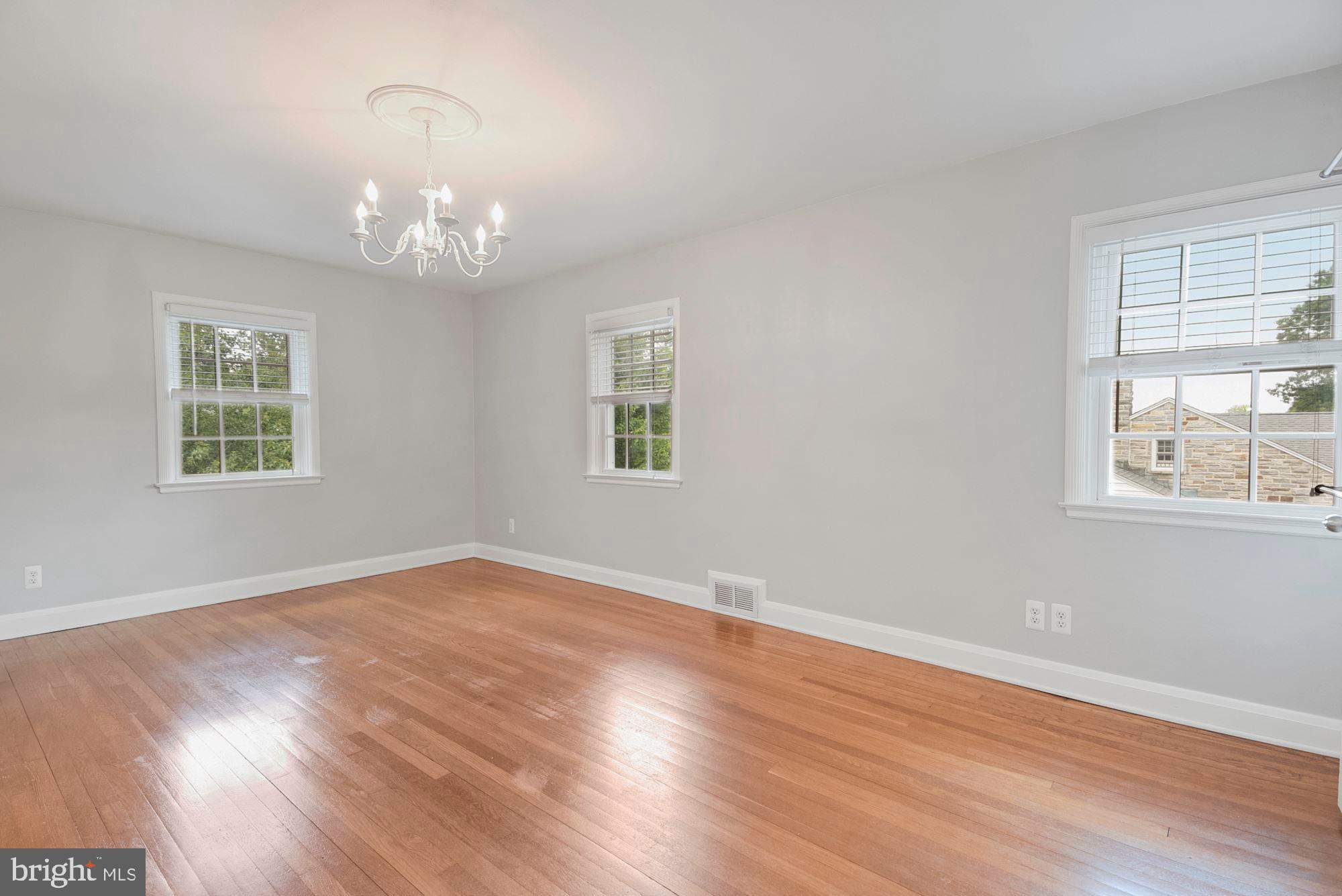 527 Yarmouth Road Towson, MD 21286 - Photo 35 of 61 Master bedroom chandelier in hardwood floors