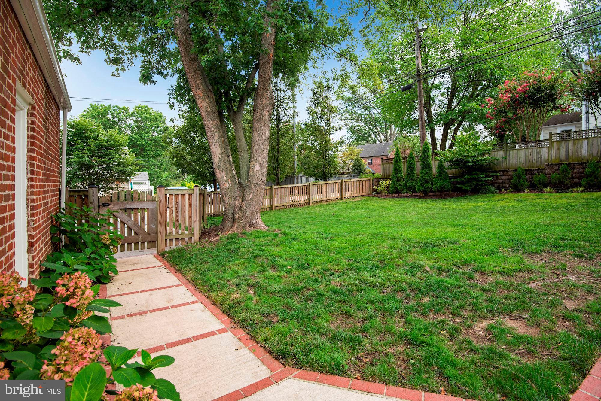 527 Yarmouth Road Towson, MD 21286 - Photo 54 of 61 Backyard walkway to the driveway with inlaid brick